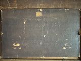 an old suitcase sitting on a shelf in a room