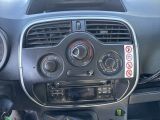 a car dashboard with a radio and a steering wheel