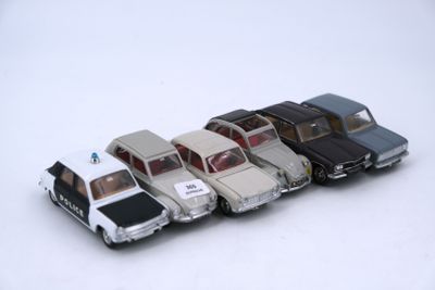 several toy cars are lined up in a row on a white surface