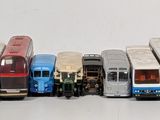 a lot of buses that are lined up in a row