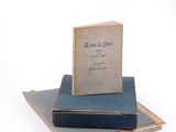 two books stacked on top of each other on a table