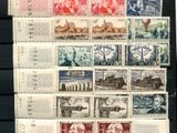 an image of a collection of stamps on display in a black frame