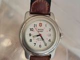a close up of a wrist watch with a black strap