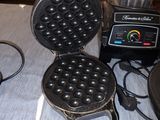 a waffle maker and a blender sitting on a table