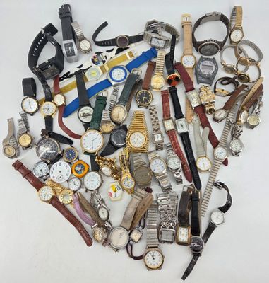many different types of watches arranged in a heart shape