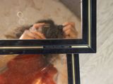 a reflection of a woman taking a picture in a mirror