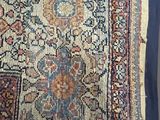 an image of a rug is laying on the floor next to a wall