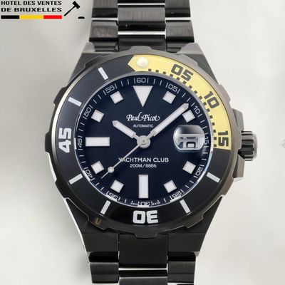 a black and yellow watch on a black bracelet