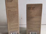 two boxes of mystery fudge on a white surface