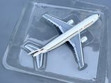 a plastic tray with a model of a plane in it