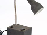 a lamp that is sitting on top of a block