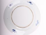 a white plate with a blue and white design on it