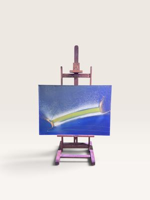 un petit chevalet sur lequel est accrochée une peinture représentant un surfeur