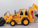 a toy bulldozer with a bucket on the back of it
