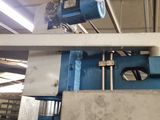 a picture of a machine that is working on a piece of metal