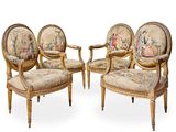 three chairs with a tapestry on the back of them and one with a painting on the back of the chair