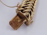 a gold necklace with a chain attached to it that has a usb drive attached to it