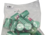 a bag of green pills on a white background