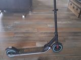 a scooter that is sitting on the floor in the living room