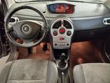 a car dashboard with a digital clock and steering wheel