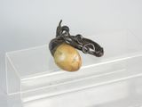 a small object that is on a clear shelf