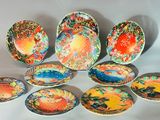 a lot of colorful plates that are on the table