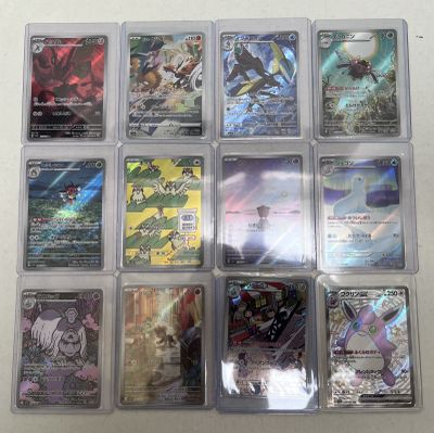 a lot of pokemon cards in a plastic case