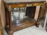 a small table with a mirror on top of it