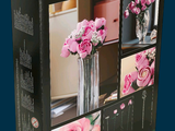 a box with a bunch of pink flowers inside of it