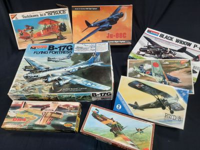 a lot of model airplanes on a black surface