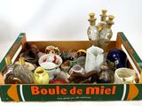 a box with a lot of bottles and vases in it