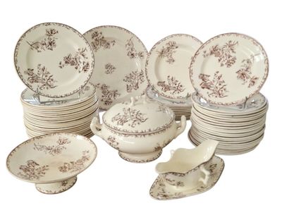 many different types of plates and bowls on the table