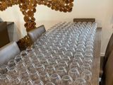 a long table that has many glasses on it