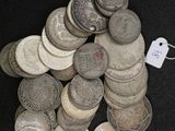 a pile of coins with a price tag on top of it