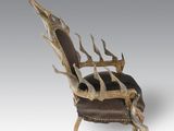 an image of a chair with antlers on it