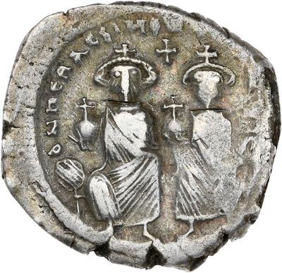 une pièce de monnaie en argent portant l'image d'un homme et d'une femme