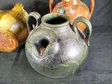 three vases sitting next to each other on a table
