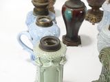 many different vases that are sitting on a table
