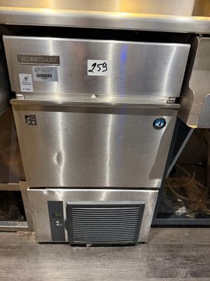 a stainless steel dishwasher that is sitting on a counter