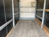an image of the inside of a truck with the door open