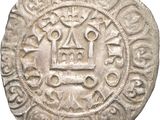 a close up of a silver coin with a design on it