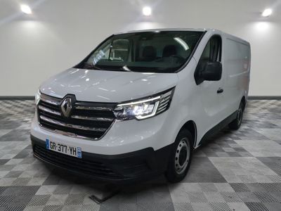 the white van is parked on a checkered floor in a room