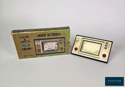 a small electronic device that is sitting next to a box