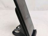a cell phone that is sitting on a stand