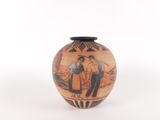 a vase with a picture of a man and a woman on it