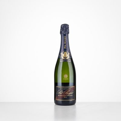 a bottle of champagne on a table with a white background