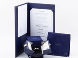 an open blue box with a ring inside of it