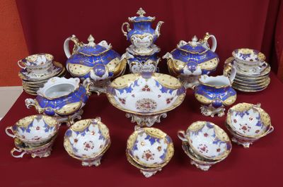 a picture of a table with a lot of blue and white china