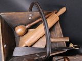 a wooden box filled with different types of tools