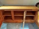 an image of a wooden cabinet with two doors open
